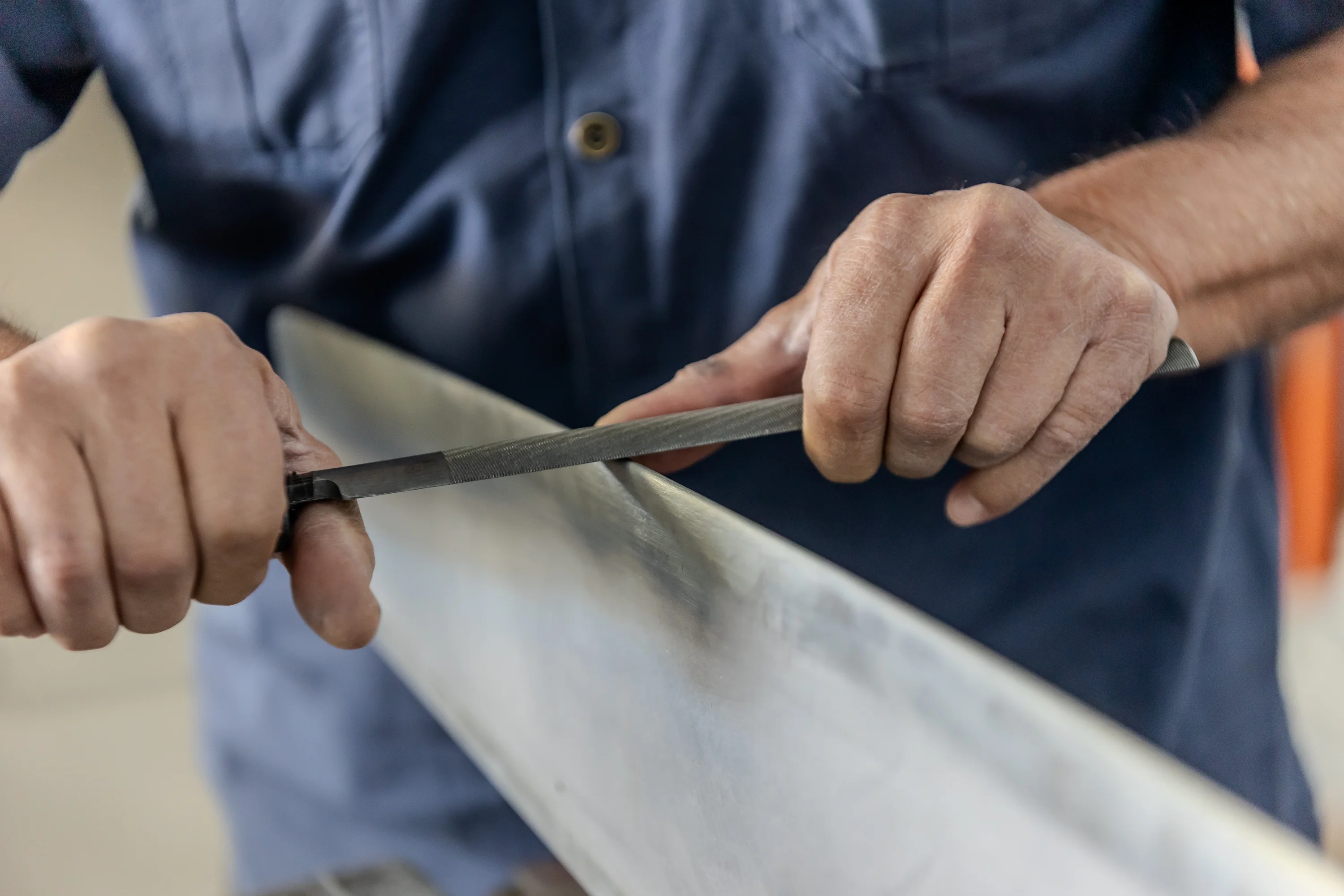 Close-up of careful propeller blade preparation