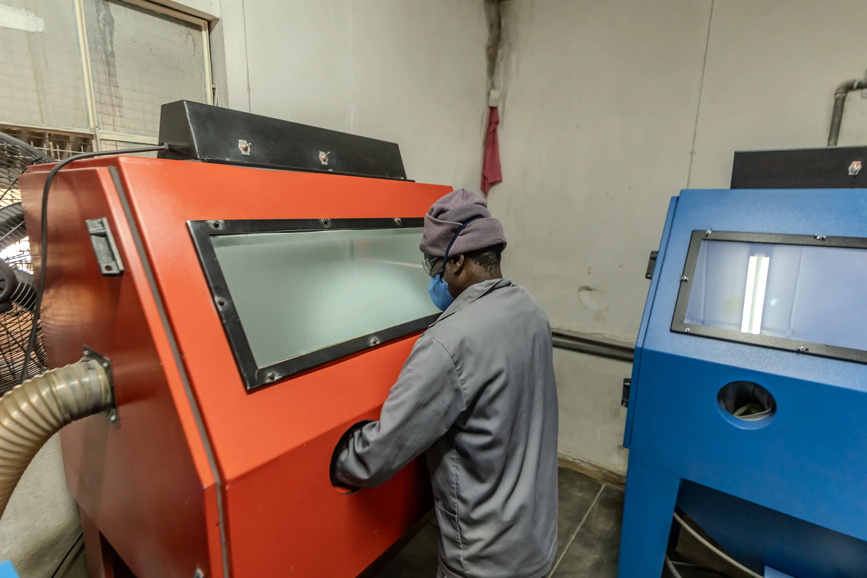 Technician operating specialist workshop equipment